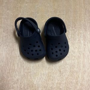 Crocs. Color navy. Size 2/3 infant. Excellent used condition. Smoke-free home.